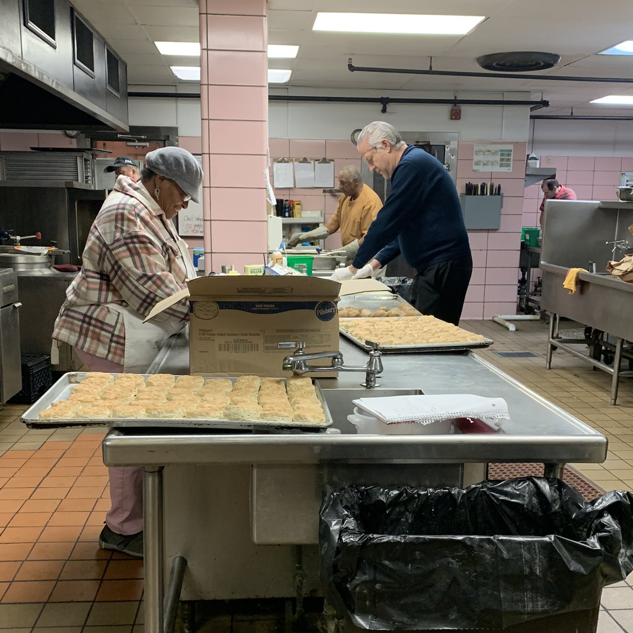 Volunteers prepare Thanksgiving meals at Wayside Christian Mission in Louisville